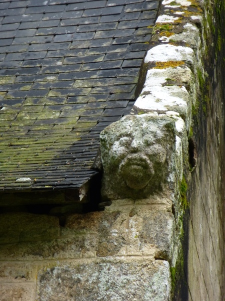 A carved face on the exterior of the chapel of St Gildas, Morbihan